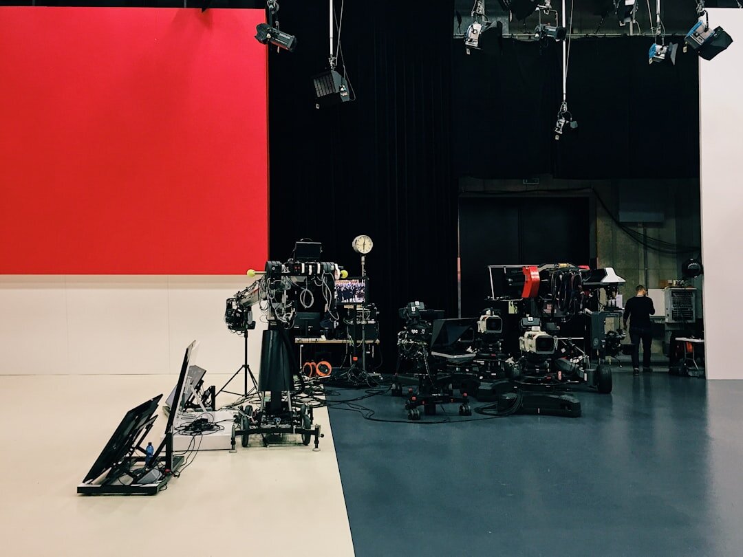 Camera operator filming in a television studio